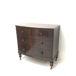 Victorian mahogany bow front chest, two short and two long drawers, turned supports