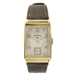 Lord Elgin 14ct gold gentleman's manual wind rectangular wristwatch, stamped 14K, on brown leather strap