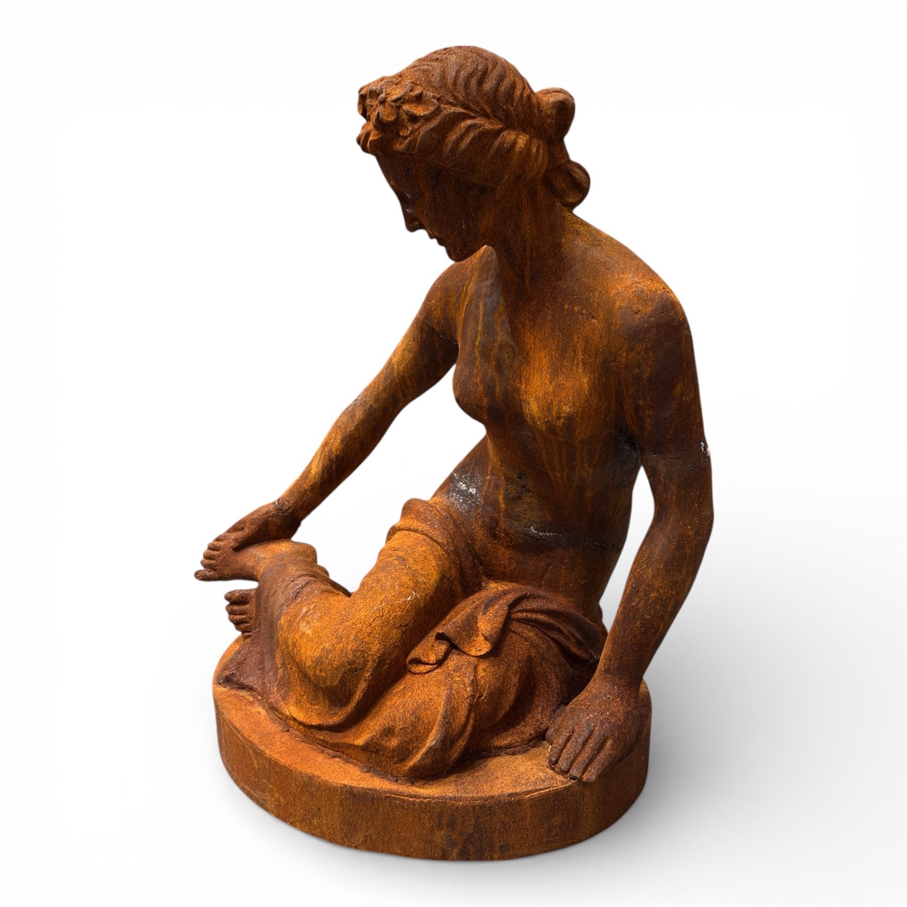 Victorian design cast iron semi-nude seated lady, on oval plinth base