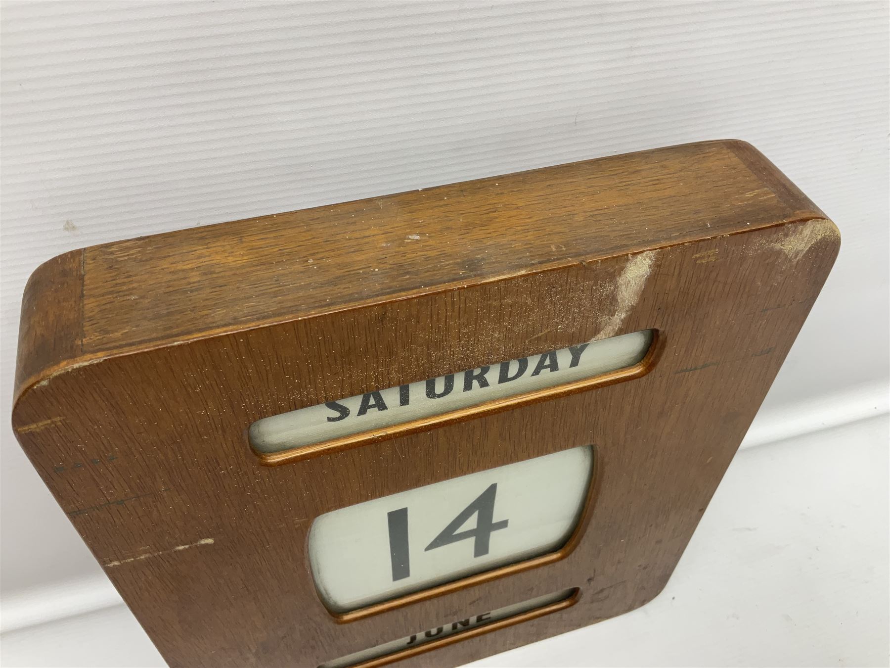 Wooden wall mounted perpetual calendar with printed rollers and chrome plated knobs to side, H30cm W27cm