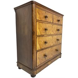 Early 20th century figured walnut chest, fitted with two short over three long drawers with bookmatch veneer facias, each with turned walnut handles, skirted base over compressed bun feet 
