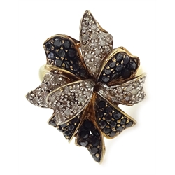  9ct gold (tested) white and black diamond flower design ring    