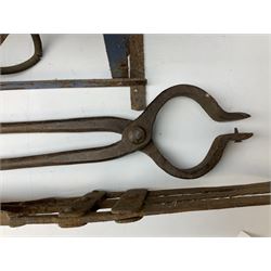 Blue and red painted gas powered bird / pest scarer, bearing label 'Exid bird & pest scarer, imported by C.R.E.A.C.O Hadleigh, Essex', , copper and brass Cymag gas hand pump, three eel spears and a set of badger tongs. Auctioneer's Note: These traps are sold as artefacts for ornamental purposes only as the use of some of them is illegal.