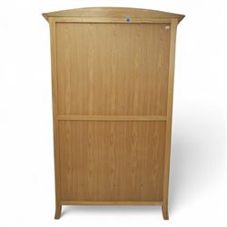 Contemporary oak double wardrobe, with fitted hanging rail above two drawers, raised on splayed feet