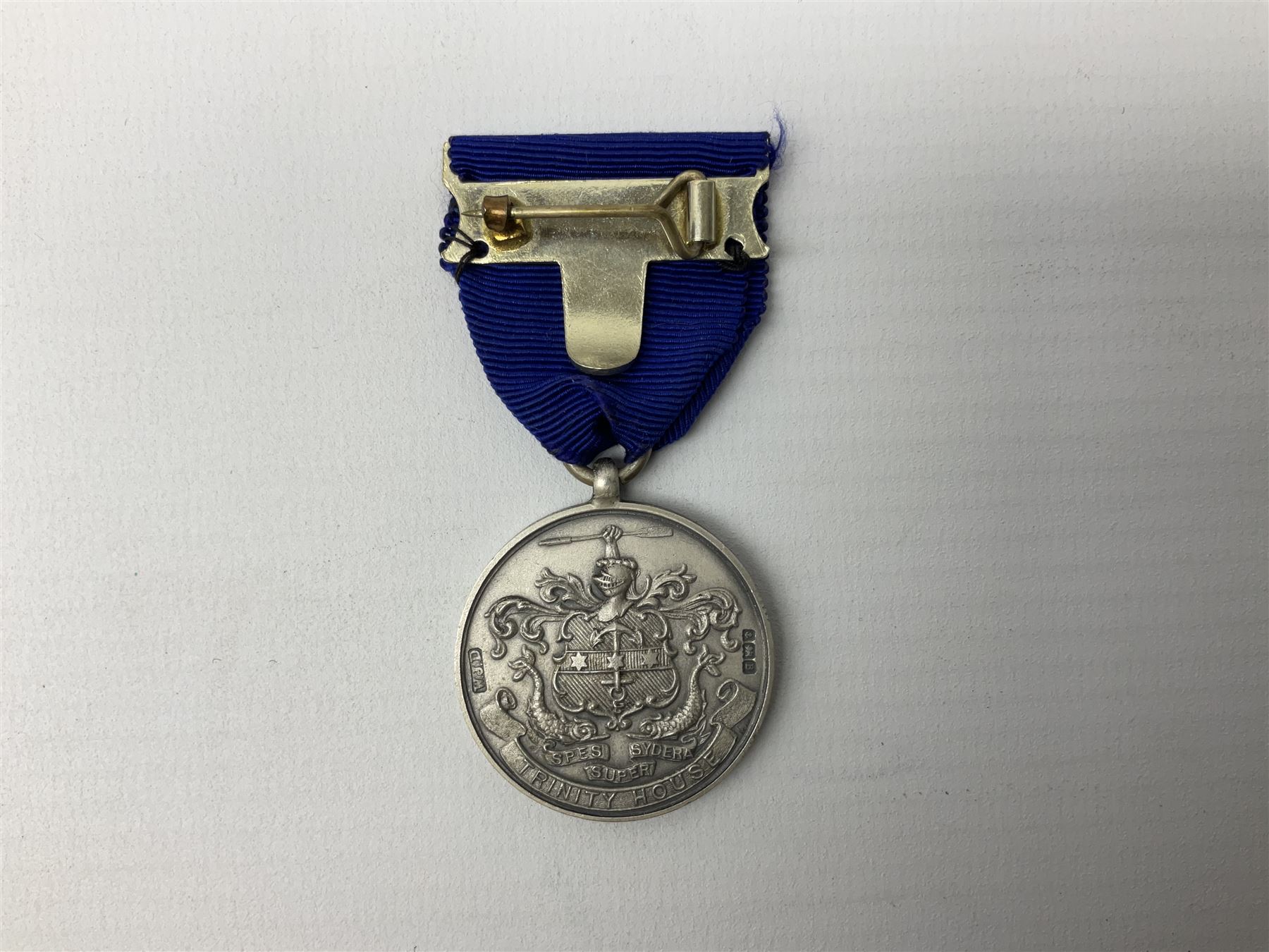 Trinity House Hull - hallmarked silver medal commemorating the visit of the Prince of Wales October 13th 1926; photograph of Captain J. Collins Warden 1934-35; photographic postcard of Capt. Collins onboard ship with other crew members; and six Trinity House uniform buttons