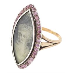 18th / 19th century gold and silver paste stone set portrait ring, the navette bezel set with a miniature of a woman on ivory, under a glazed panel, within a pink paste border and trifurcated shoulders. This lot has been registered for sale under Section 10 of the APHA Ivory Act