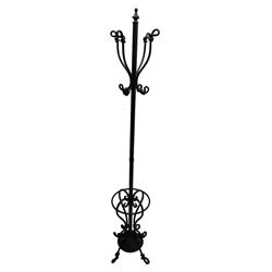Bronze finish wrought metal coat stand, scrolled and twisted designed, the base with umbrella and stick stand 