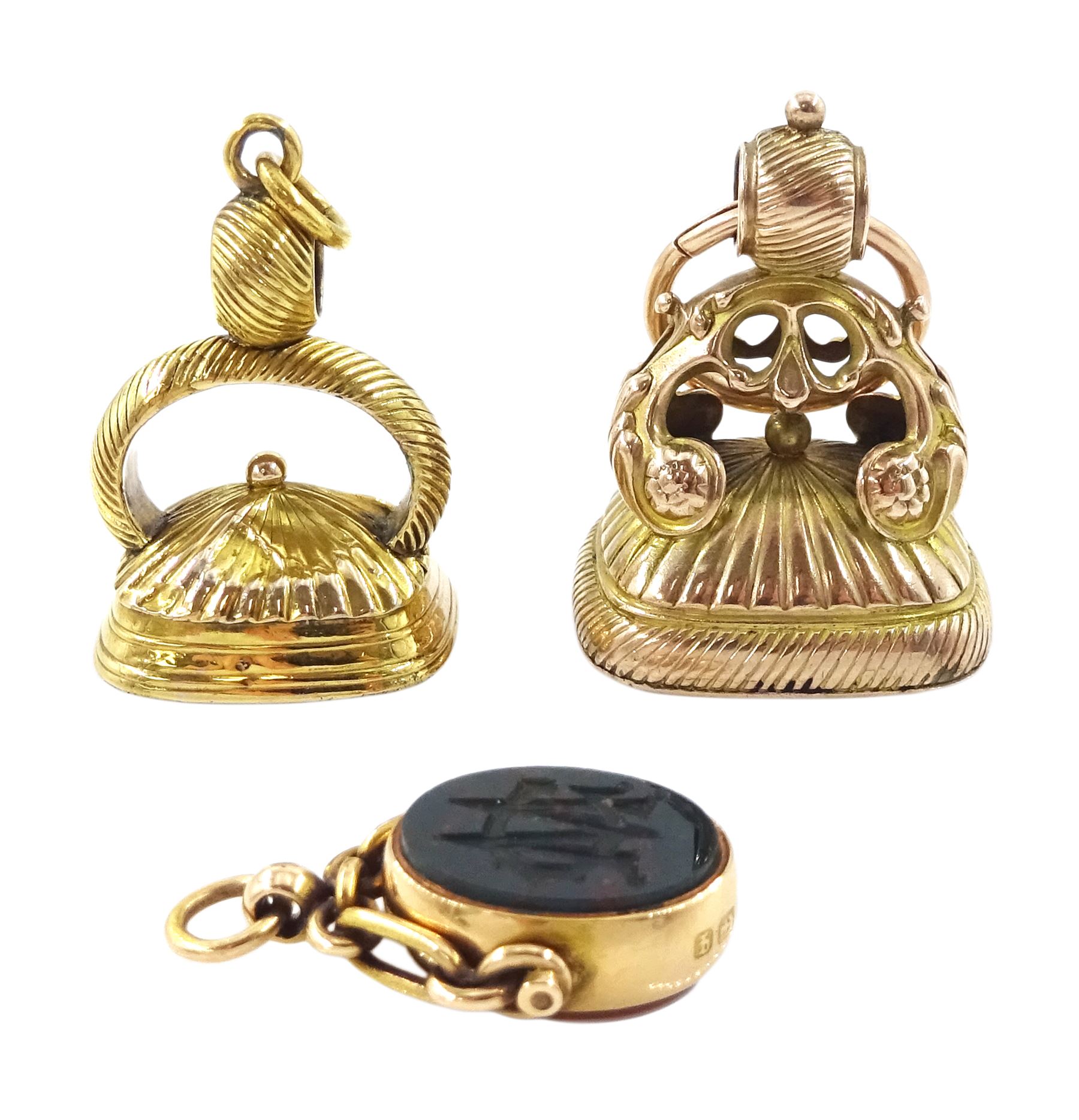 Victorian 15ct gold swivel fob, the agate intaglio depicting a crescent moon above a castle and inscribed 'Noli Me Tangere', the reverse bloodstone monogrammed 'MG', Birmingham, 1890 and two gold-plated carnelian and agate intaglio fobs, all with wax seal impressions