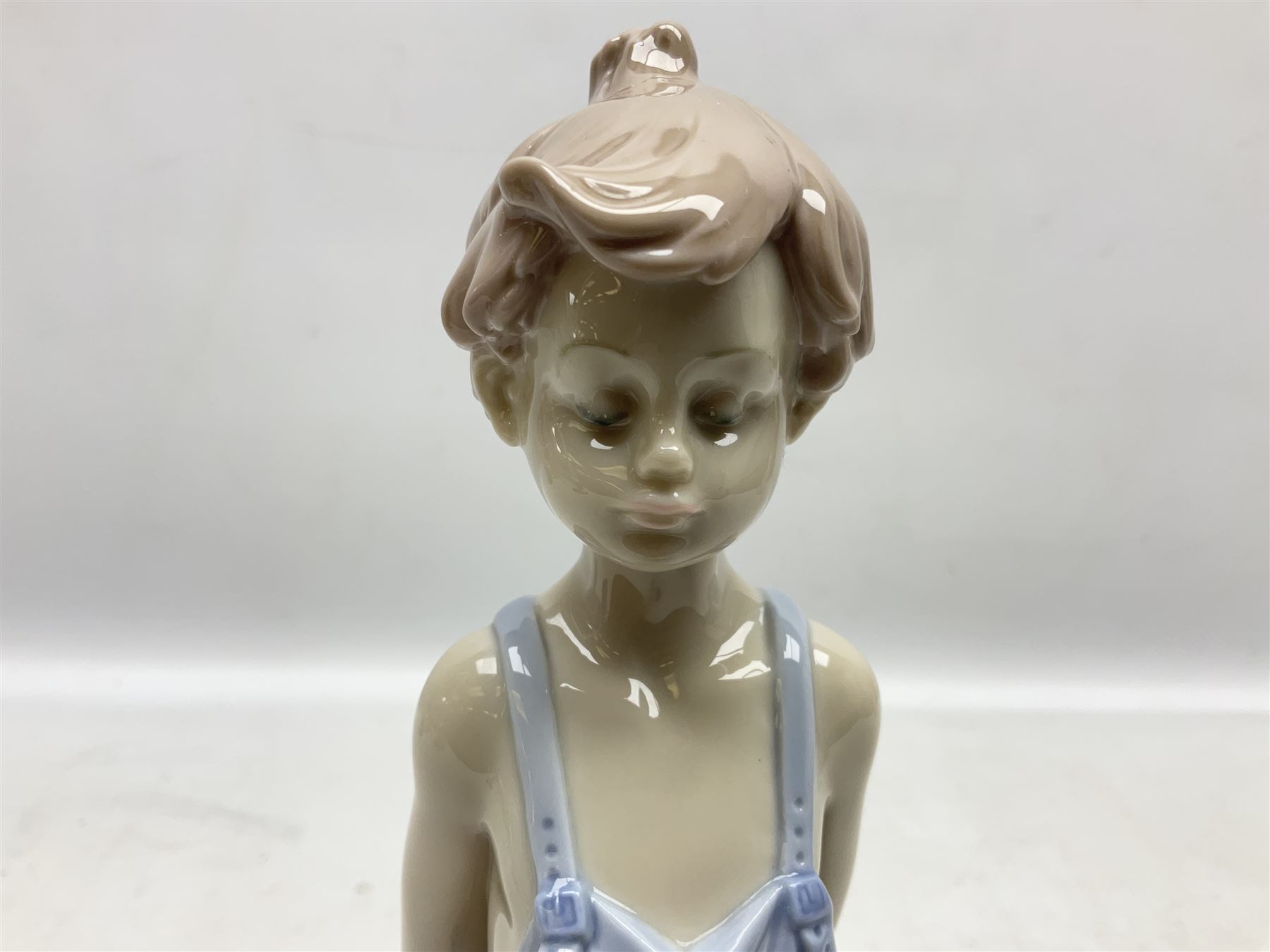 Three Lladro figures comprising, Pocket Full of Wishes no 7650, School Days no 7604 and Spring Bouquets no 7603, all with original boxes, largest example H26cm  