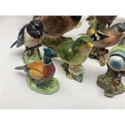 Collection twenty one of Beswick bird figures, to include Lapwing no 2416, Kingfisher no 2671, Red Pigeon 1383, Cuckoo no 2315, Nuthatch no 2418 etc