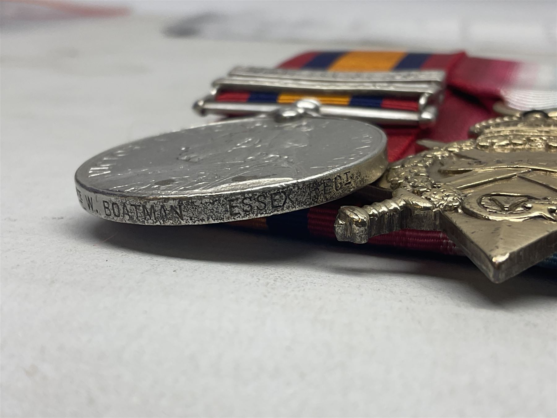 Boer War/WW1 group of four medals comprising Queens South Africa Medal with two clasps for South Africa 1902 and Cape Colony awarded to 6278 Pte. W. Boatman Essex Regt.; together with British War Medal, 1914-15 Star and Victory Medal awarded to 10849 Pte. W. Boatman G. Gds.; all with ribbons and mounted for display on card; some photocopied biographical information.