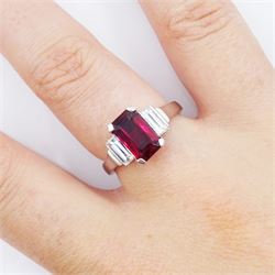 18ct white gold ruby and diamond three stone ring, single emerald cut Thai ruby of approx 2.00 carat, with a baguette cut diamond set either side, hallmarked, total diamond weight approx 0.60 carat