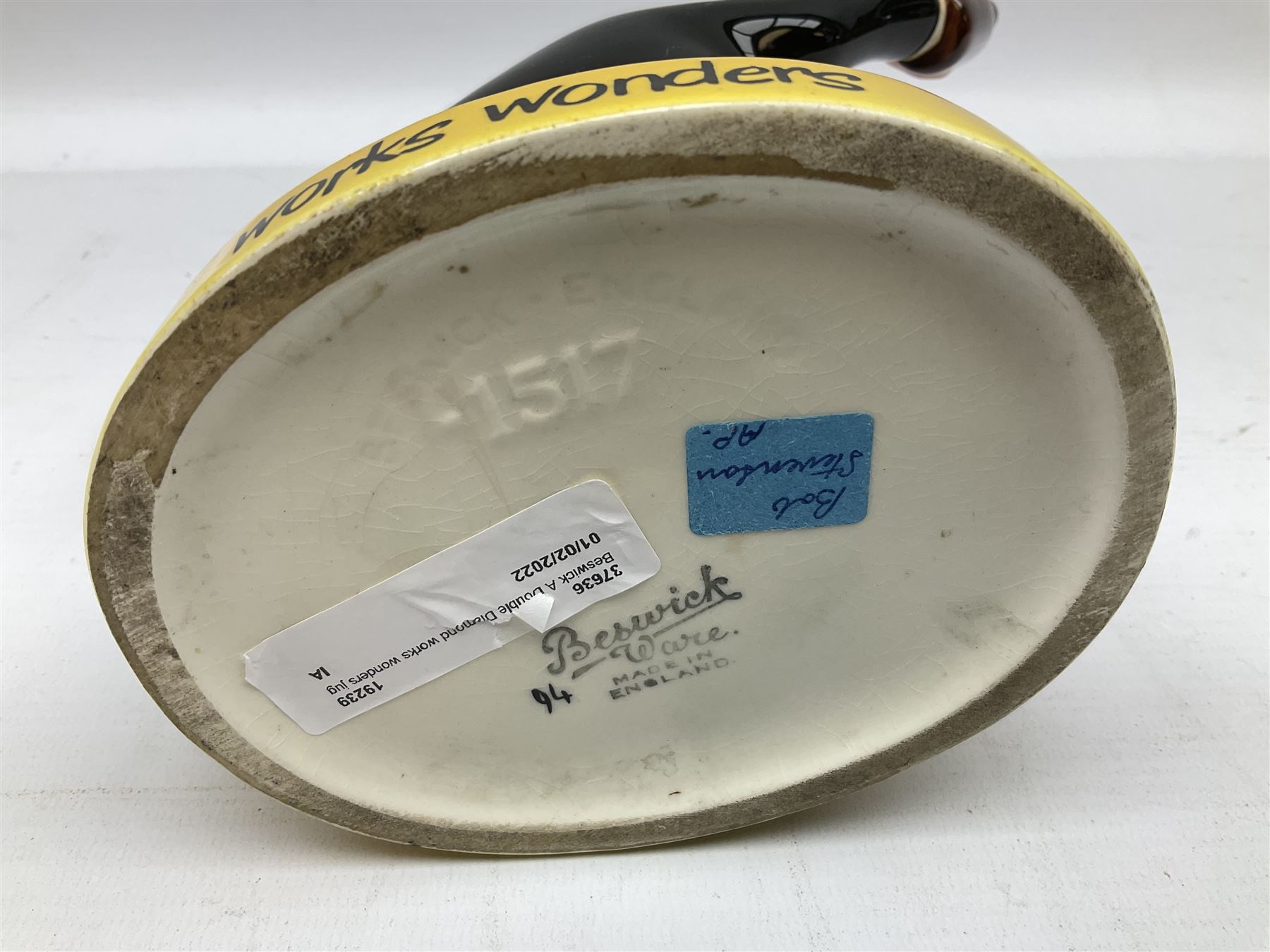 Beswick 'Double Diamond Works Wonders' advertising decanter in the form of a business man with briefcase and bottle, with impressed and printed marks beneath