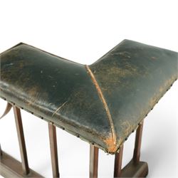 Early 20th century brass and buttoned green leather club fender with plain uprights 