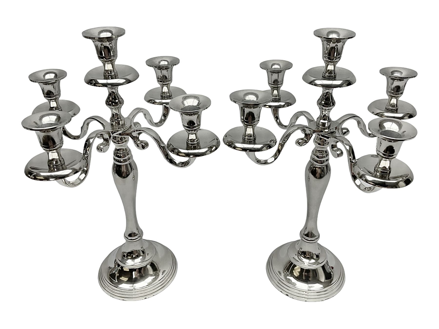 Pair of four branch candelabras, urn-shaped nozzles raised upon scroll branches supported from tapering central stem, with a stepped circular base, H40cm
