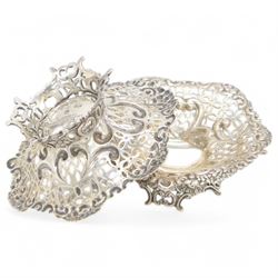 Pair of late Victorian silver bon bon dishes, of hexagonal form with embossed and pierced scrolling decoration, upon a circular pierced base, hallmarked Goldsmiths & Silversmiths Co, Birmingham 1893, W11cm, H4cm