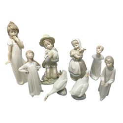Three Lladro figures, Boy blowing kiss no. 4869, Girl With Hands Akimbo no.4872 and Girl with hands out no. 4868, together with five figures  