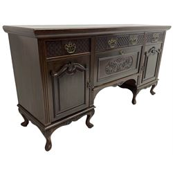 Late Victorian walnut sideboard, moulded rectangular top over three drawers  with blind fretwork facias, fitted with central fall front cupboard with extending foliage carved decoration and two flanking panelled cupboards, on acanthus carved cabriole feet