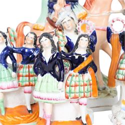 Group of Staffordshire figures, mostly Highland examples, to include figure with bagpipes upon horseback, figure group of Highland Mary and Byron, two figure groups depicting pair of dancers holding flag aloft, two pairs of recumbent sheep, one pair with fags, largest example H30cm
