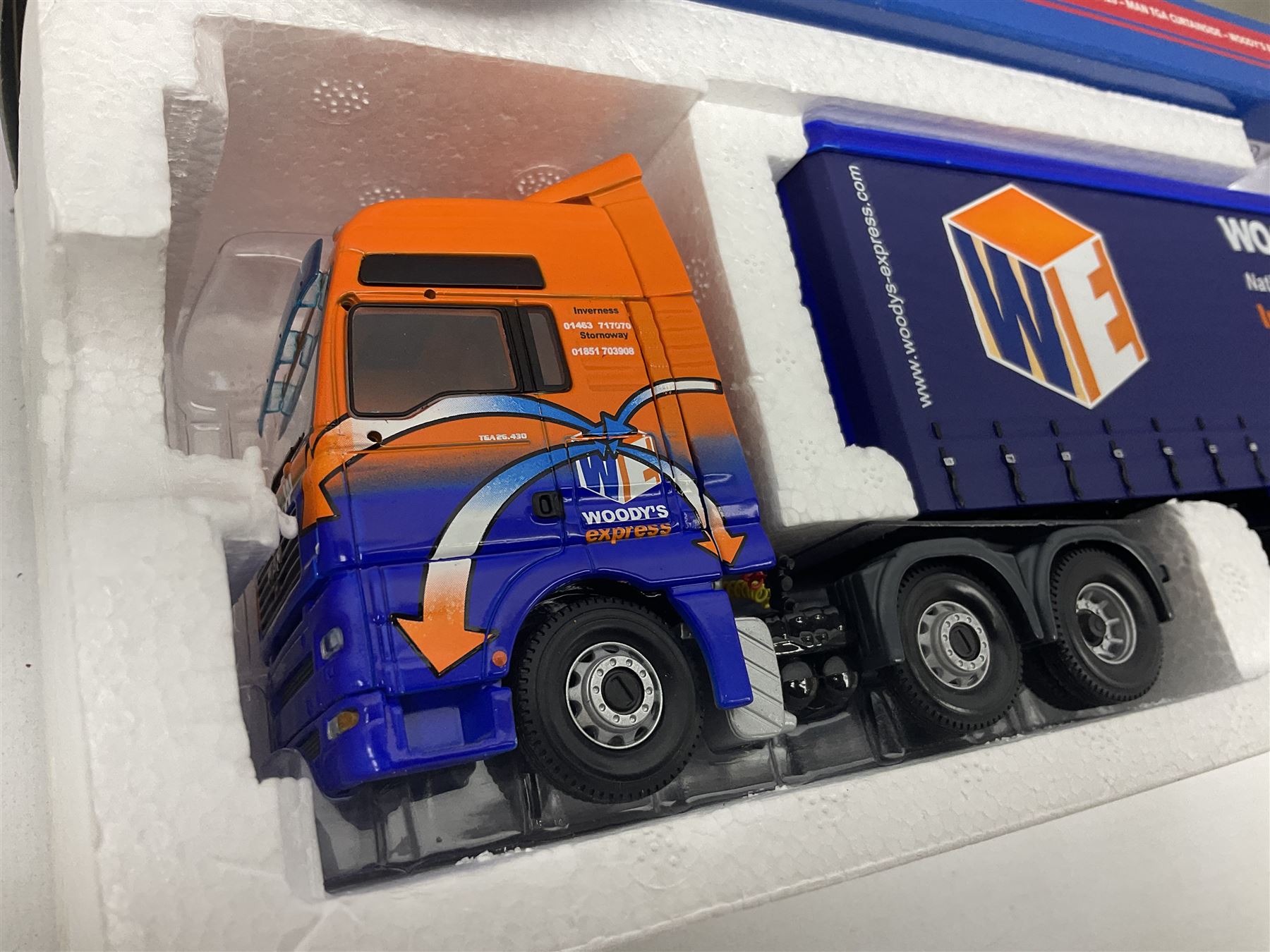 Corgi - three limited edition Hauliers of Renown lorries; CC13231 DAF XF Curtainside James Irlam & Sons Ltd; CC13420 MAN TGA Curtainside Woody's Express; and CC13603 DAF CF Curtainside Tyson H. H. Burridge Ltd; all boxed (3)