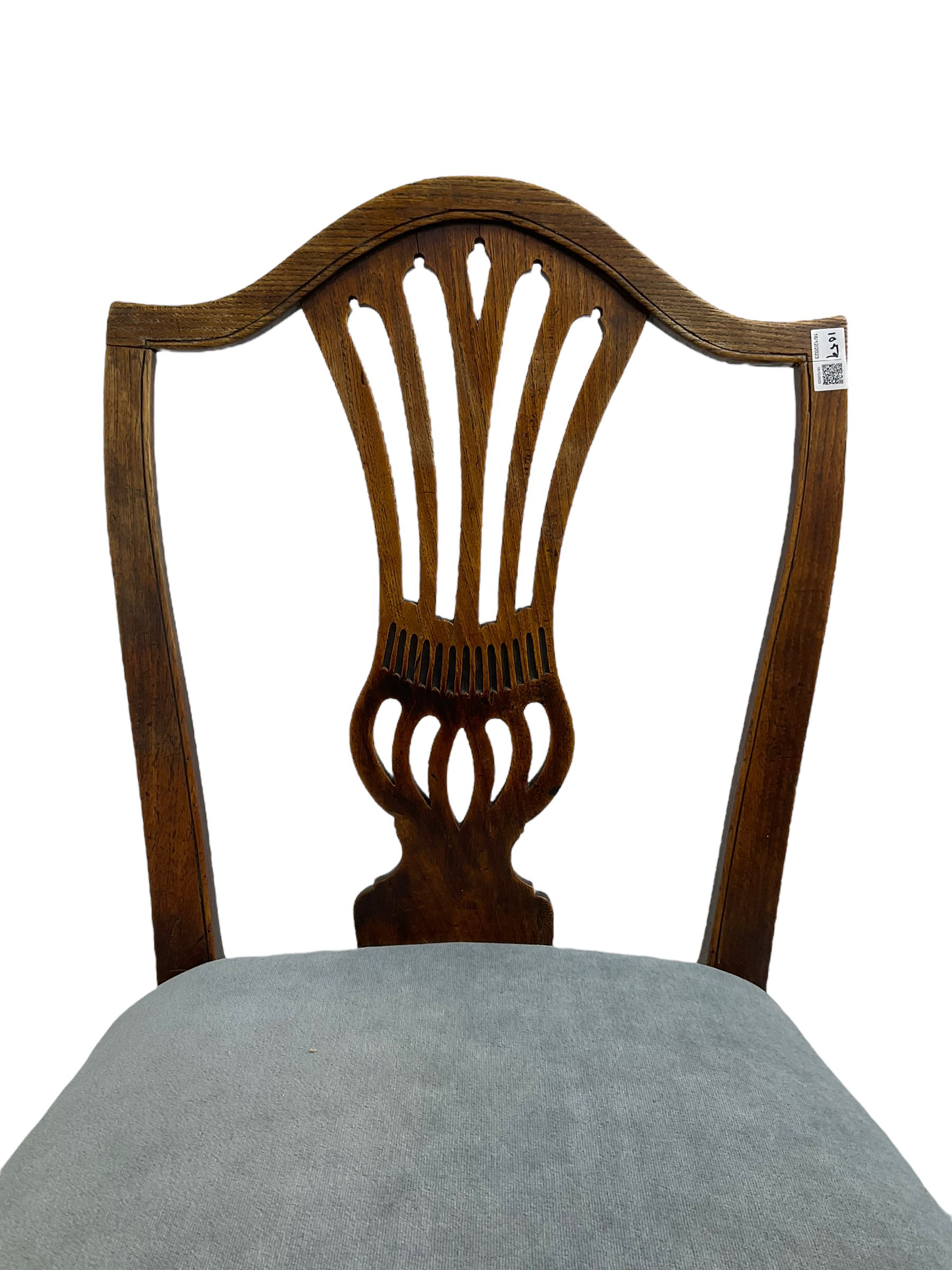 Early 19th century elm side chair, shaped cresting rail over vasiform splat with pierced decoration (W53cm, H96cm); Hepplewhite period mahogany side chair, shield back with pierced splat, on square tapering supports with spade feet (W55cm, H99cm); George III walnut elbow chair, shaped cresting rail and moulded frame, upholstered drop-in seat, on square supports with inner chamfer (W59cm, H95cm) (3)