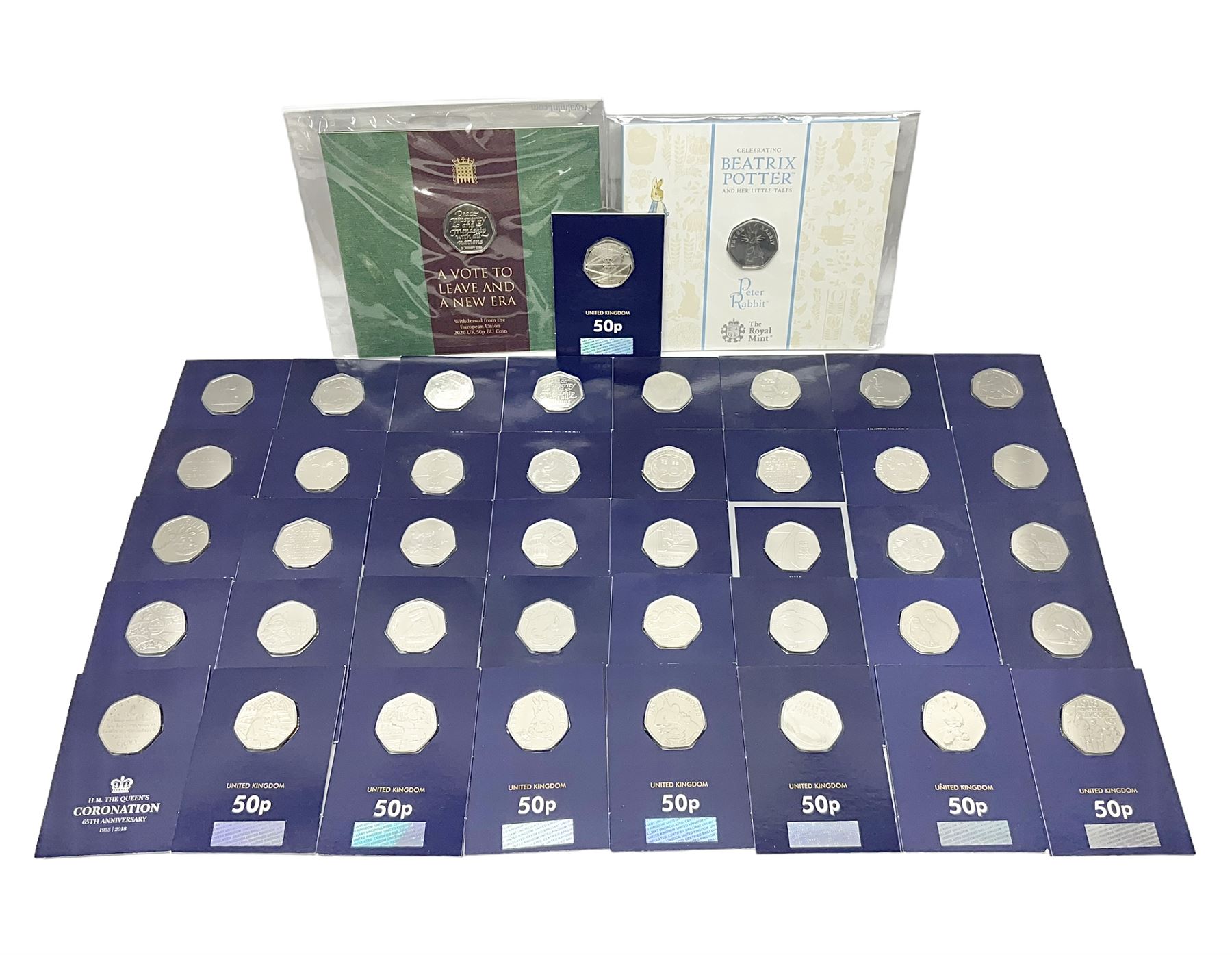 Mostly United Kingdom Queen Elizabeth II commemorative fifty pence coins, including 2019 'Gruffalo', 2020 'Iguanodon', 2022 'The Queen's Jubilee' etc, housed on cards, face value of UK coins approximately 20 GBP