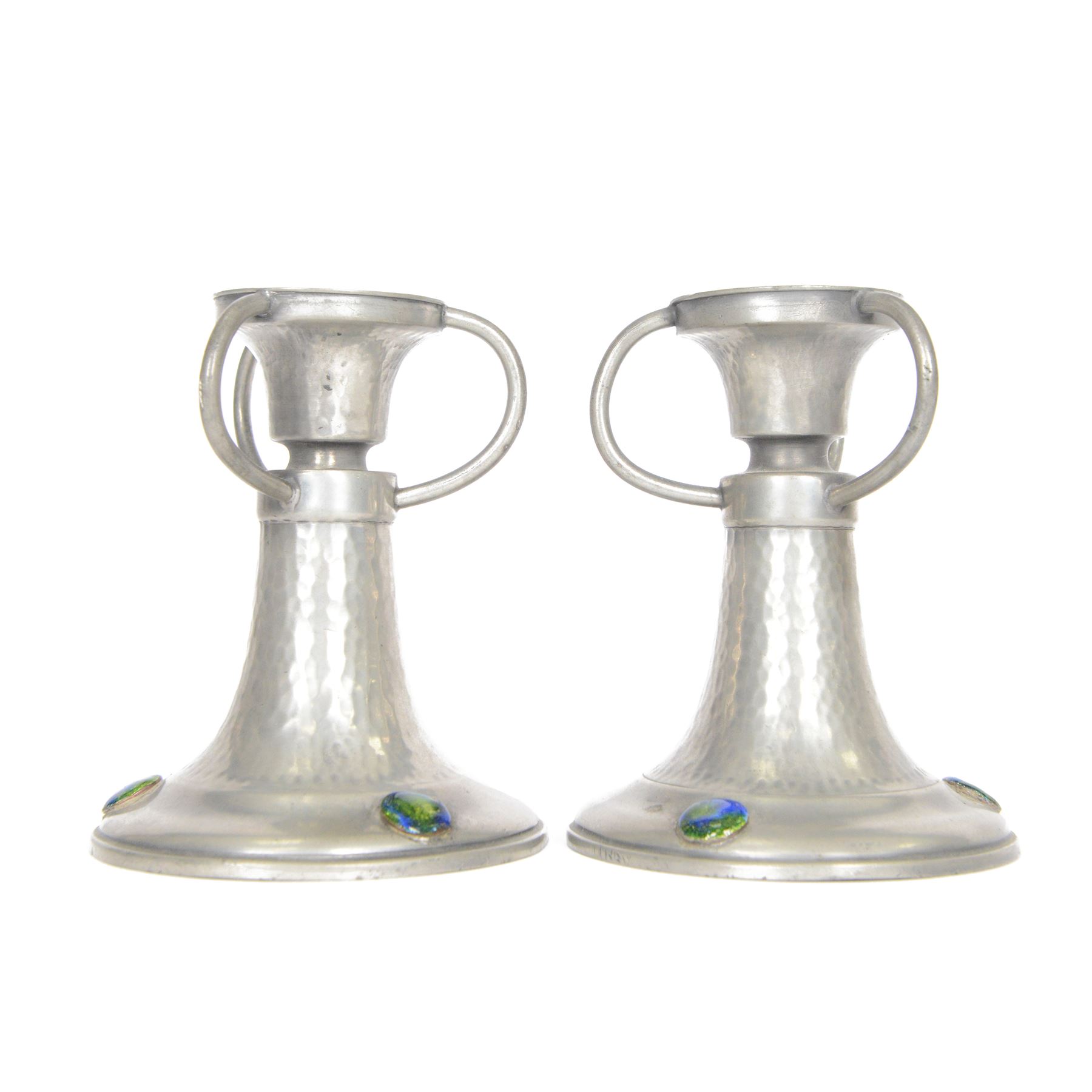 Pair of  Jugendstil hammered pewter candlestick each set with three blue and green enamel roundels, marked Germany beneath, H12cm