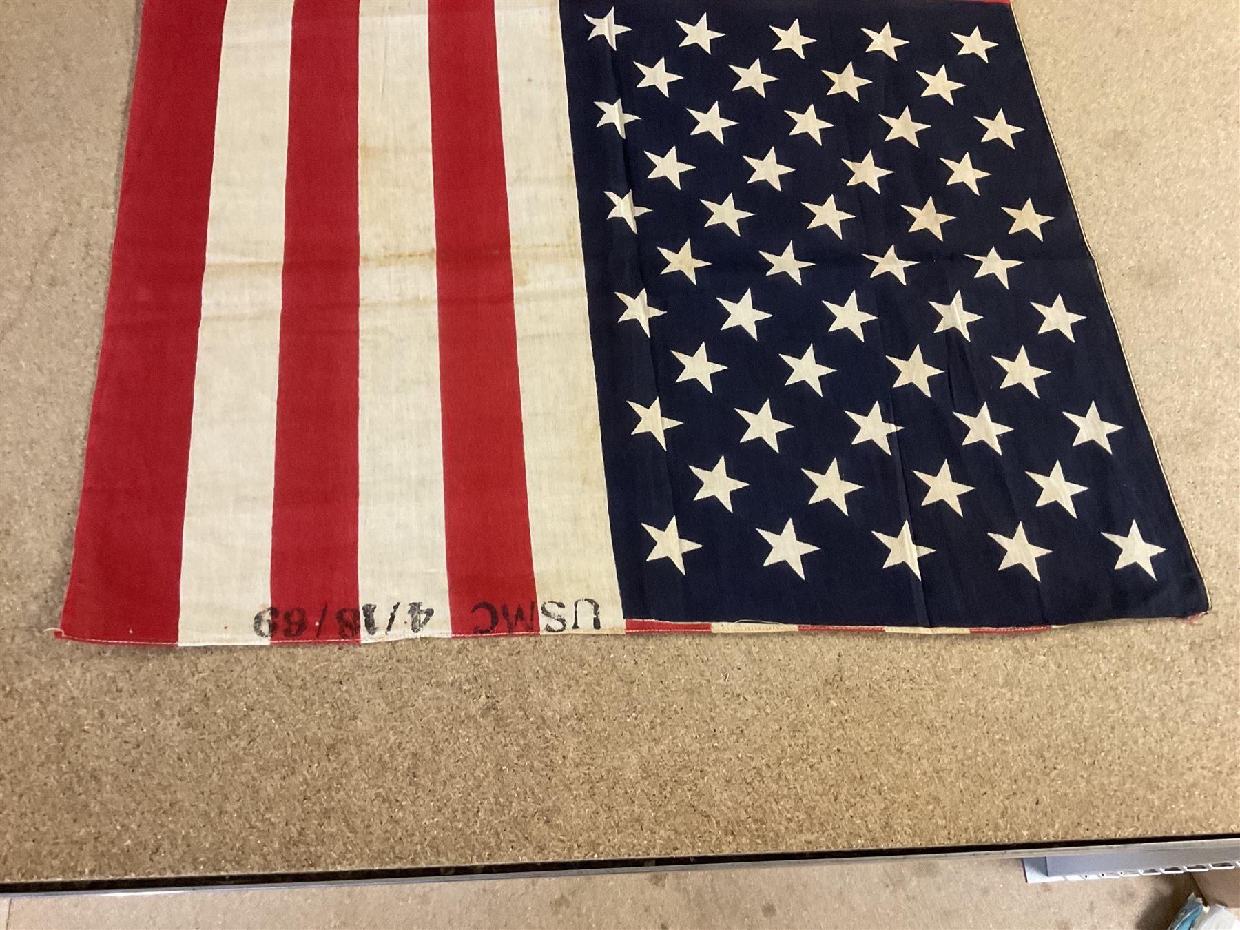 Vietnam War; two North Vietnamese military flags, together with a United States Marine Corps Vietnam period stars and stripes flag 