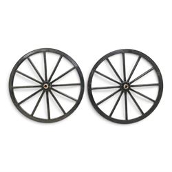Pair of Victorian black lacquered and painted cartwheels with twelve spokes