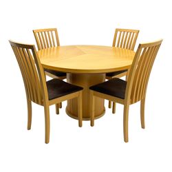 Skovby - 'SM32' late 20th century beech circular extending dining table circular segmented top turning to activate a patented spring loaded triple leaf extension stored within the cylindrical column base (Extended diameter 146cm); and set of four chairs (Width 47cm, Depth 56cm, Height 95cm, Seat height 47cm)