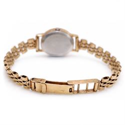 Omega ladies gold-plated quartz wristwatch, gilt dial with baton hour markers, on 9ct gold bracelet, Birmingham 1977, boxed with original leather strap