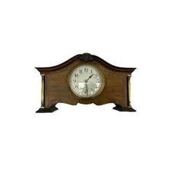 An Edwardian mantle clock in a mahogany case with a serpentine pediment and recessed brass pillars, 3-1/2” white dial, upright Arabic numerals, minute track and quarter hour Arabic’s, steel spade hands within a fixed brass bezel, eight-day spring driven French drum movement with a cylinder platform escapement, wound and set from the rear.



