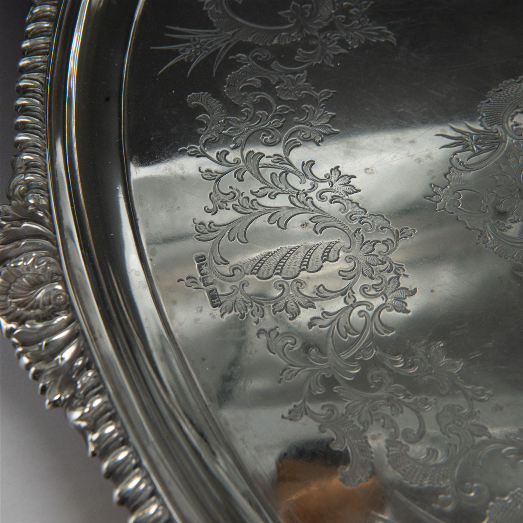 Victorian silver twin handled tray, of oval form, engraved with floral and foliate swags with vacant cartouche to centre, with oblique gadrooned rim, palmette details and foliate decoration to handles, hallmarked Atkin Brothers, Sheffield 1901, handle to handle W70cm