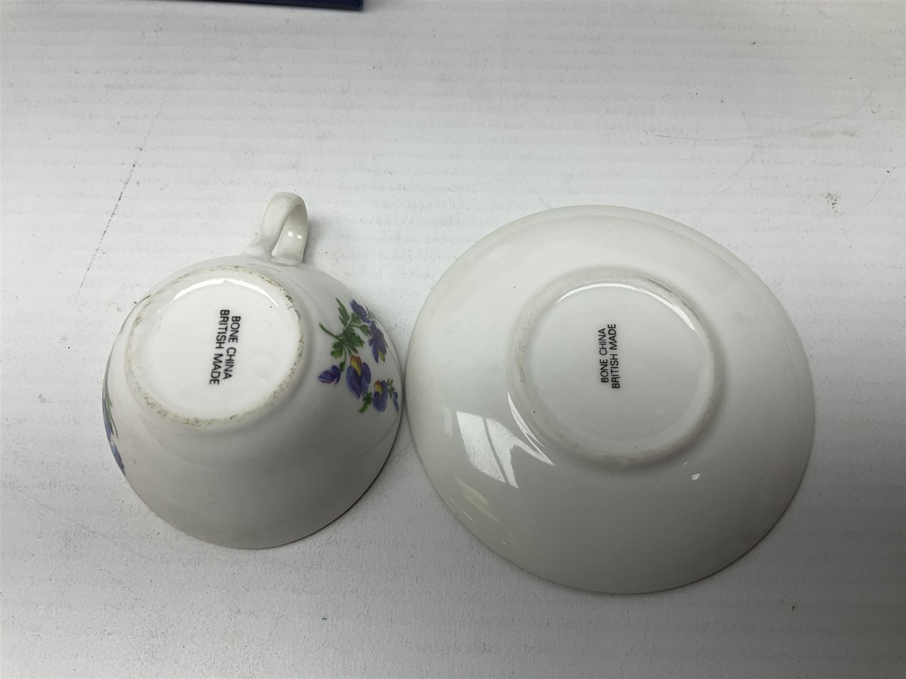 Poole pottery Dolphin, together with Royal Worcester miniature teacup and saucer, Royal Crown Derby miniature teacup and saucer in Derby Posies and one other