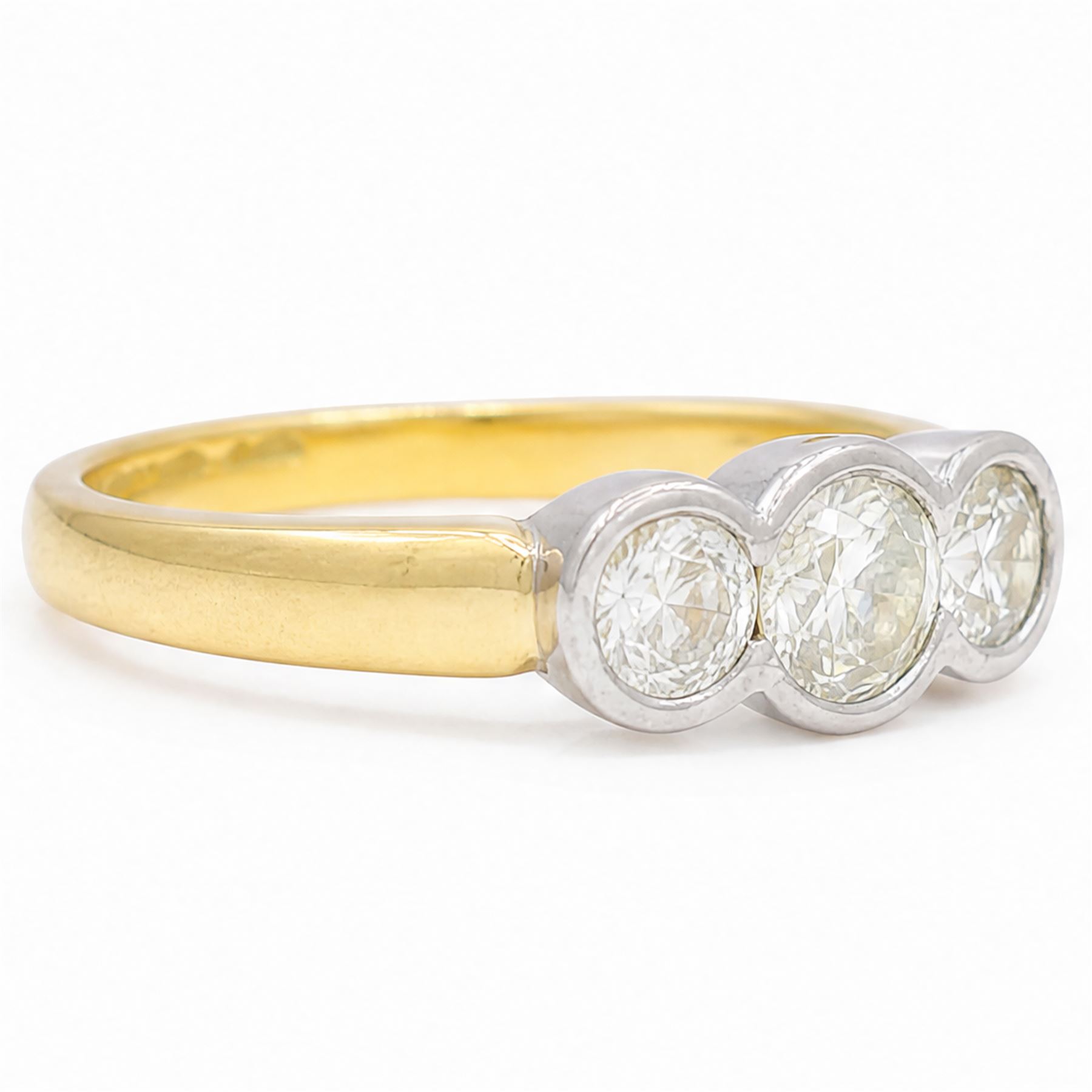 18ct gold gold and platinum diamond ring, bezel set with three old cut diamonds, Birmingham assay mark, total diamond weight approx 0.75 carat