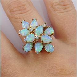 9ct gold opal and diamond stepped design ring, three round brilliant cut diamond set amongst ten pear shaped opals, hallmarked