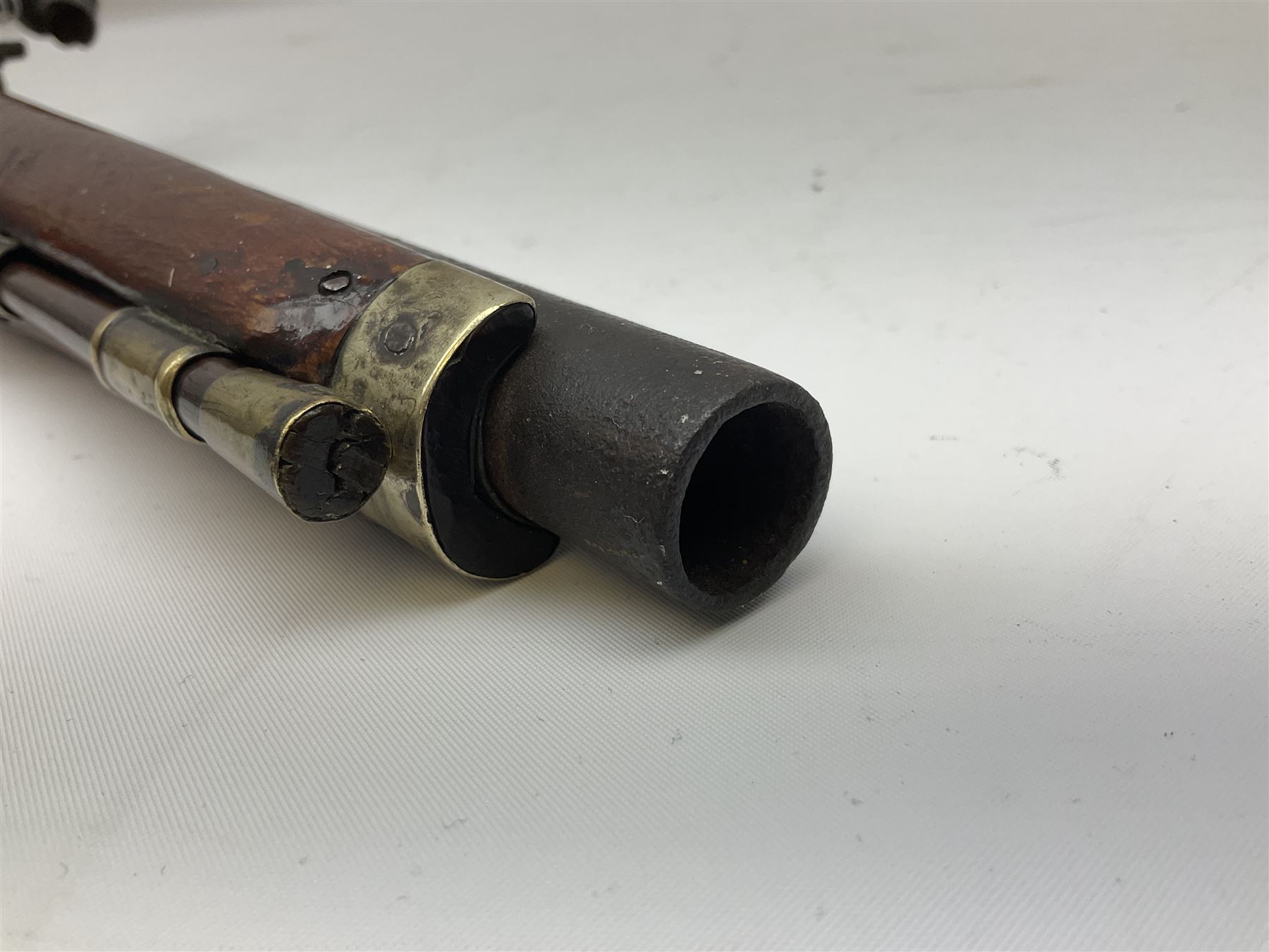 Re-manufactured percussion converted from flintlock single barrel pistol, the 20cm barrel with ramrod under, reused back action lock, brass furniture and hardwood stock L41cm overall