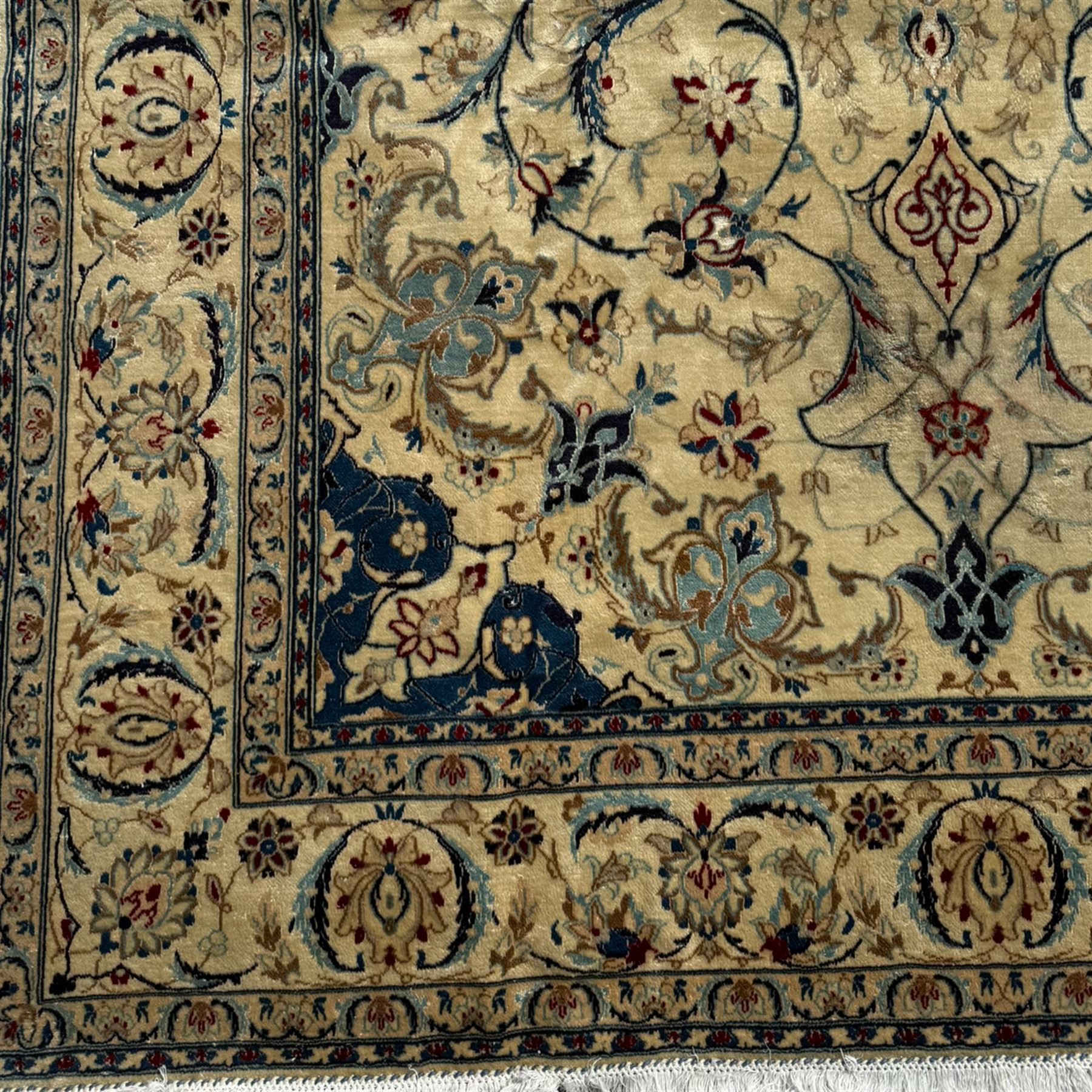 Nain Persian rug, hand knotted with a central medallion surrounded by a symmetrical arrangement of floral motifs, arabesques, curvilinear vines on an ivory background with teal and burgundy colours 