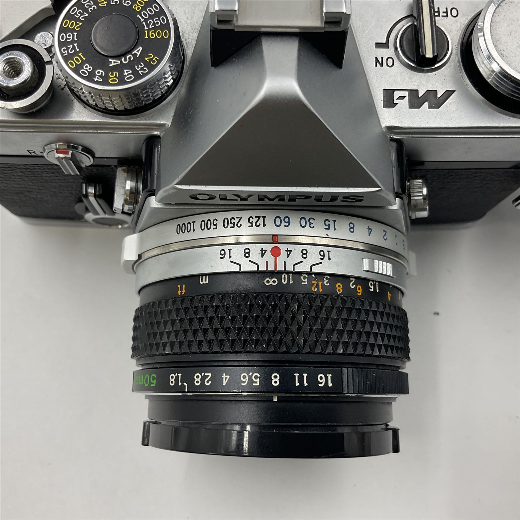 Olympus M-1 camera body, serial no. 110865, circa 1972, with ' Olympus M-System F.Zuiko Auto-S 1:1.8 f=50mm' lens, serial no. 105152, in leather case 