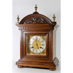Edwardian 8-day oak cased striking mantle clock striking the hours and half hours on twin bells, with a German 20th century Hermle movement and floating balance escapement (2 jewels),  square brass dial with a silvered 4