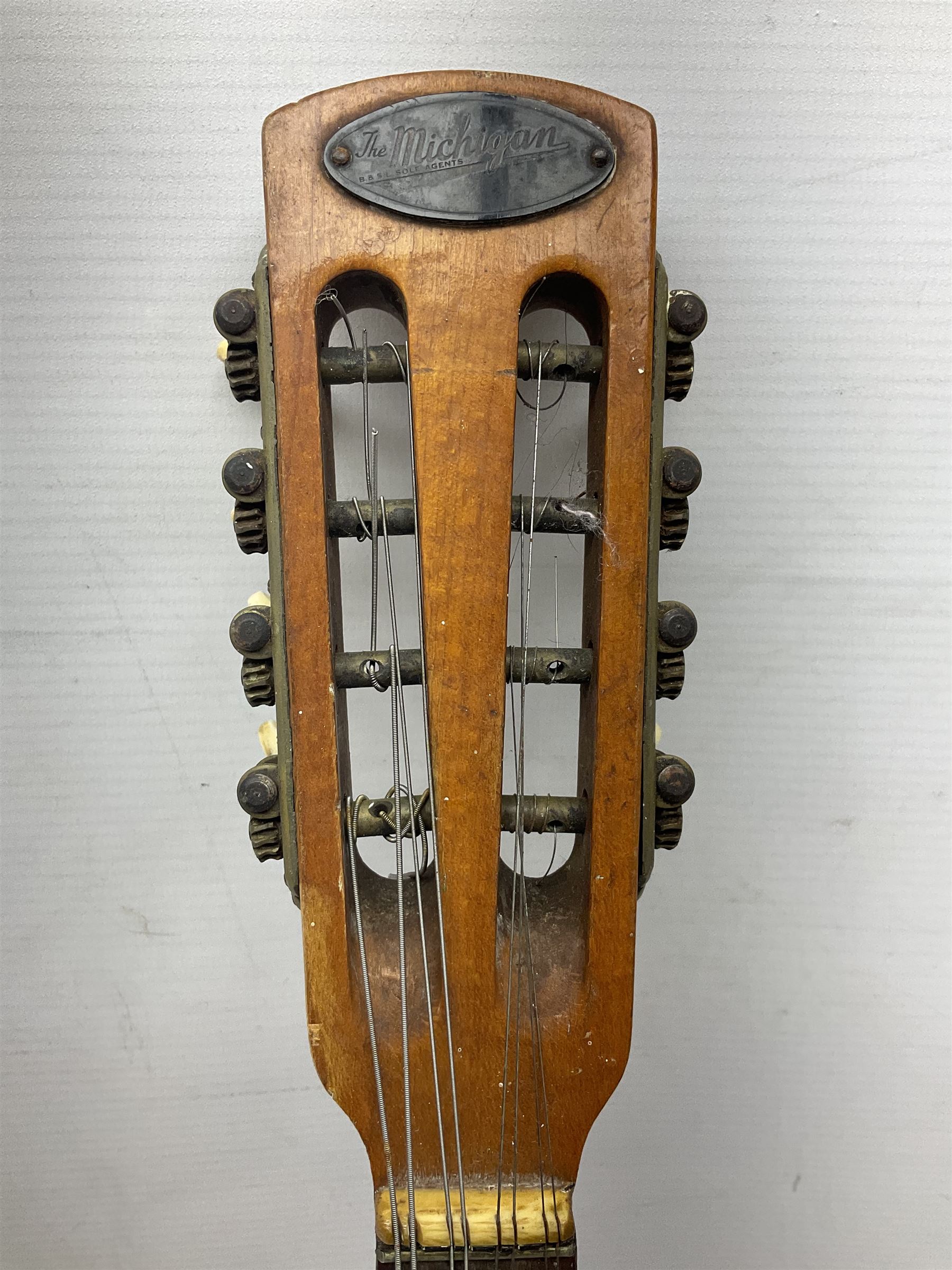 Italian eight-string mandolin with maple back and ribs and spruce top with inlaid floral marquetry panel within a fragmented mother-of-pearl border L61cm; cased; and a (damaged) German 'Michigan' mandolin for spares or repair (2)