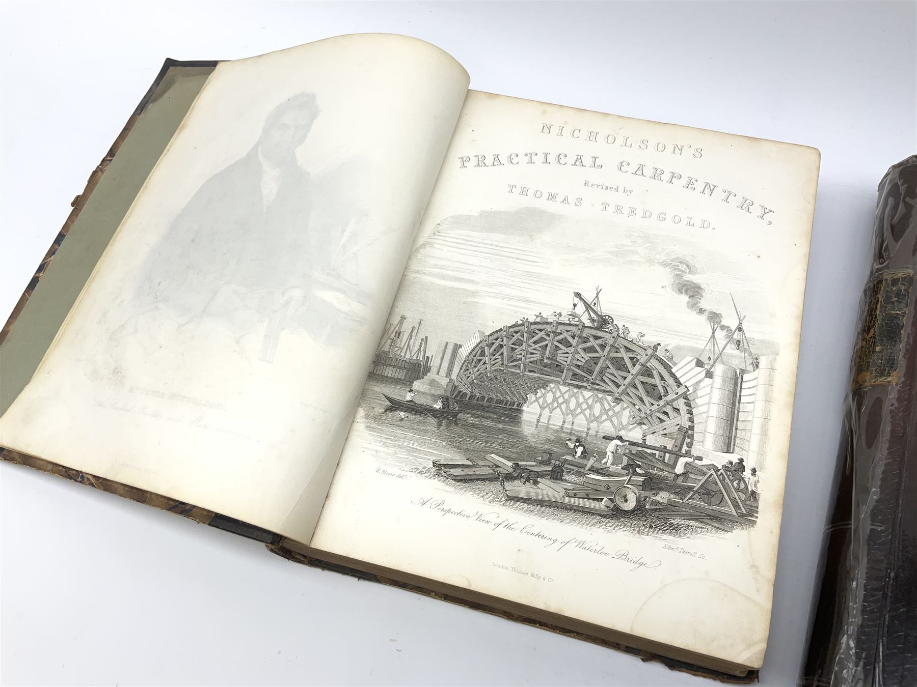 Newlands James: The Carpenter and Joiner's Assistant being a comprehensive treatise on the selection, preparation, and strength of materials and the mechanical principles of framing. Nd c1880. Later half leather binding and end papers; and Nicholson Peter (Thomas Tredgold): Practical Carpentry, Joinery, and Cabinet-Making. 1857. Half leather binding (2)