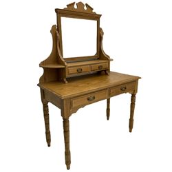 Late 19th century pitch pine dressing table, raised swing mirror back with two small trinket drawers, the table fitted with two drawers, on turned supports