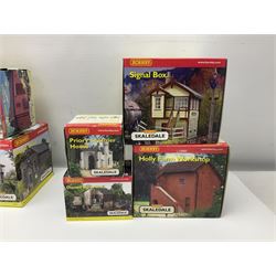 Hornby '00' gauge - thirteen Skaledale trackside buildings/accessories including R8737 Small Gasholder, R9653 Baptist Church, R8542 Holly Farm Workshop, R8534 Signal Box, R8854 Fan Drift, R8525 Holly Farm Stables, R9531 Magna Waiting Room, R8778 Fan House, R8709 Fuel oil Tanks etc; all boxed (13)