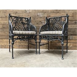 Richard Bawden (1936-2024): Pair of Cat design painted cast iron garden armchairs
