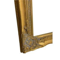 Pair bevelled edge wall mirrors in swept gilt frames decorated with ornate cartouches