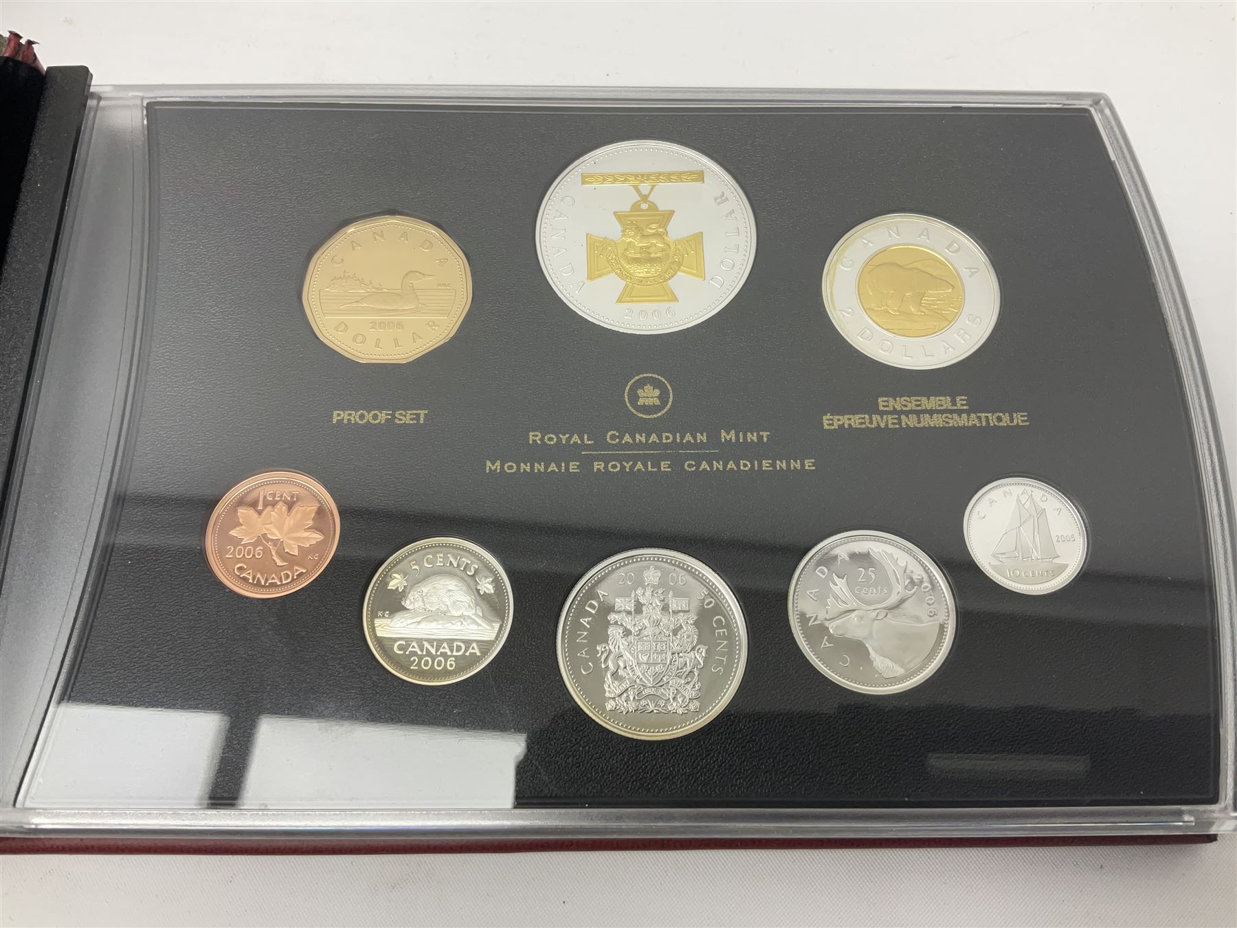 Queen Elizabeth II The Royal Canadian Mint 2006 silver proof dollar and two 2006 proof sets of Canadian coinage, all cased with certificates 