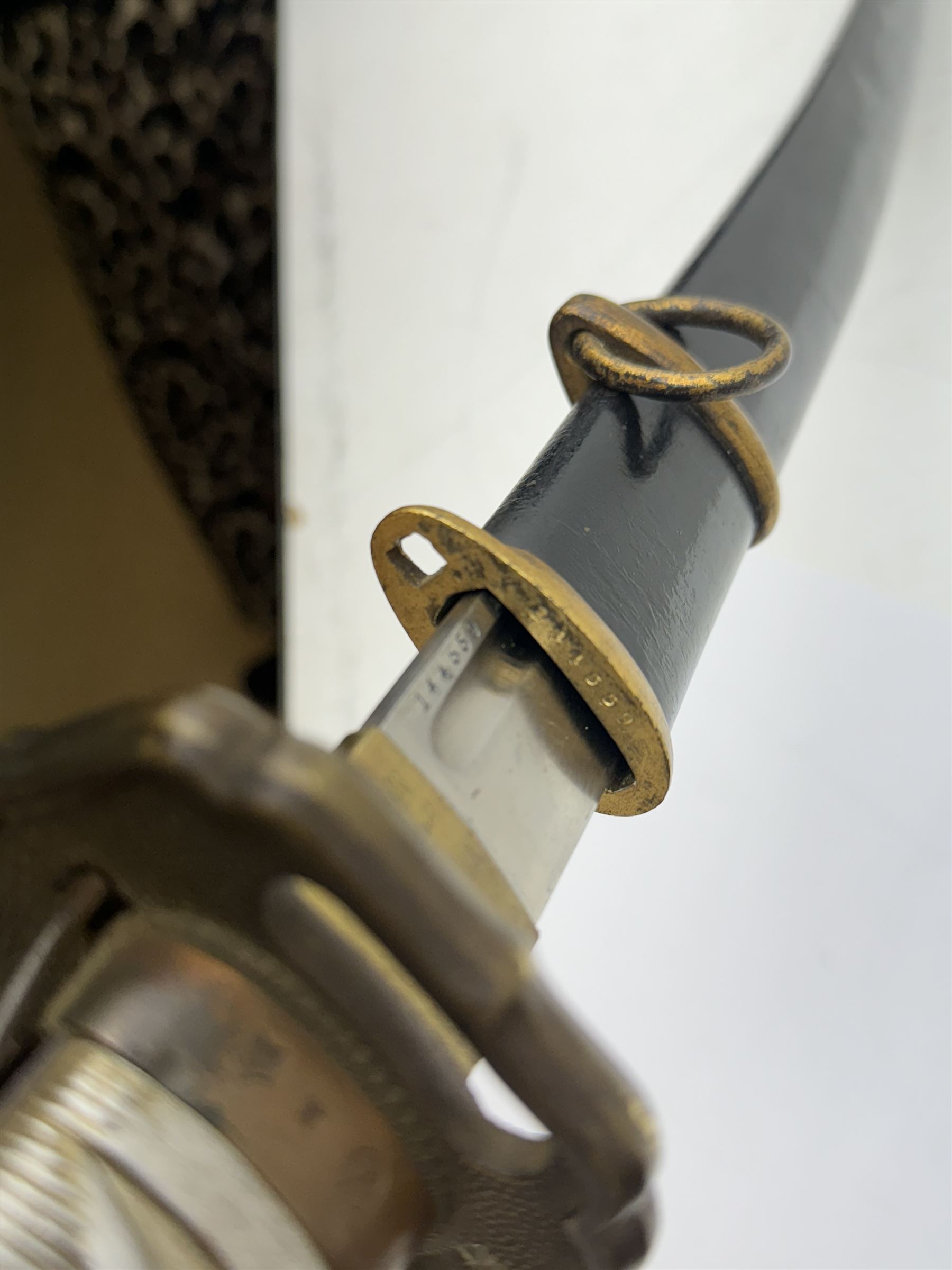 WWII Japanese katana with cast pierced tsuba, the L69cm arsenal steal blade marked 144559, with black lacquer Saya (scabbard), L97cm overall
