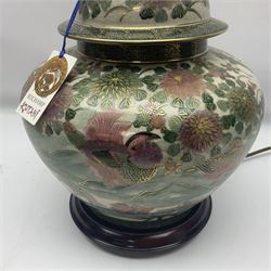 Table lamp of squat baluster form, decorated with Mandarin ducks and floral  landscape, upon a circular wooden base H42cm