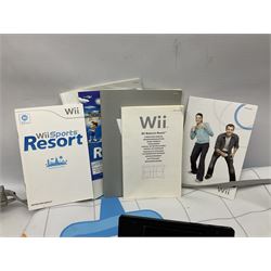 Nintendo Wii console, four controllers with cases and four nunchucks, Wii sensor bar, balance board and dance mat. Guitar hero wireless guitar for Wii and Redoctane wired guitar. Nintendo DS lite handheld gaming console, console and game cases and Guitar Hero Redoctane Guitar Grip. Selection of Nintendo Wii and Nintendo DS lite games to include Super Mario Galaxy, Guitar Hero, Wii Fit, Legend of Zelda games etc. Archos AV400 Series pocket video recorder with accessories, cradle and remote, in three boxes